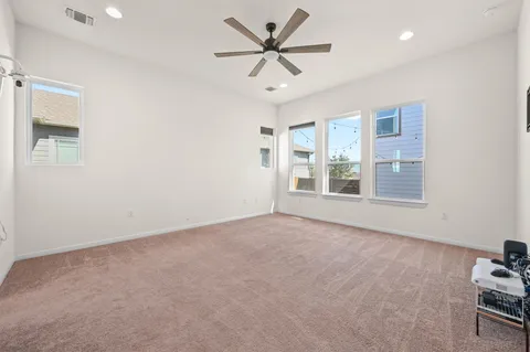 a view of a kitchen with stainless steel appliances granite countertop a stove and a sink