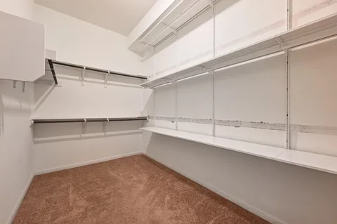 a bathroom with a granite countertop sink a mirror a bathtub and shower
