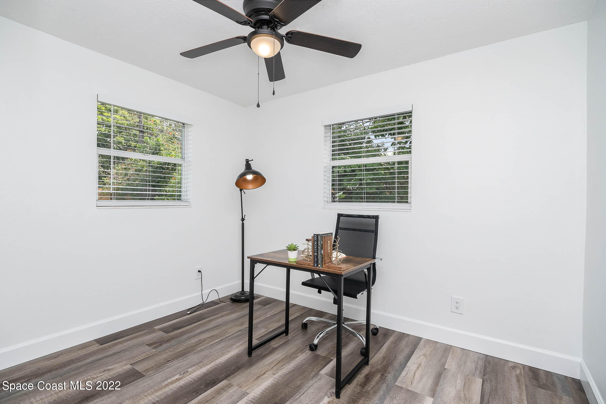 1026 Macco Road Cocoa, FL 32927 - Photo 15 of 20 a workspace with wooden floor