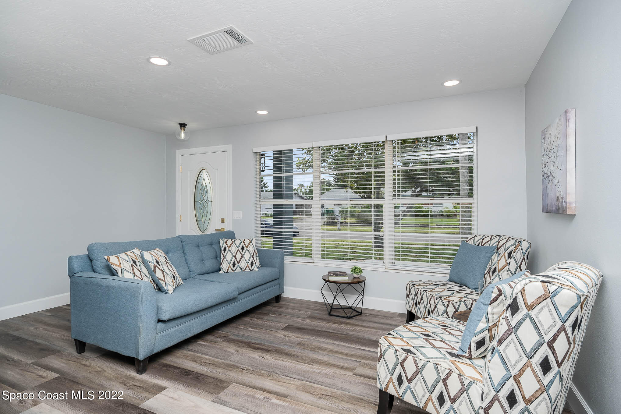 1026 Macco Road Cocoa, FL 32927 - Photo 4 of 20 a living room with furniture and a large window