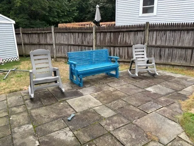 a view of a deck with wooden floor and outdoor seating