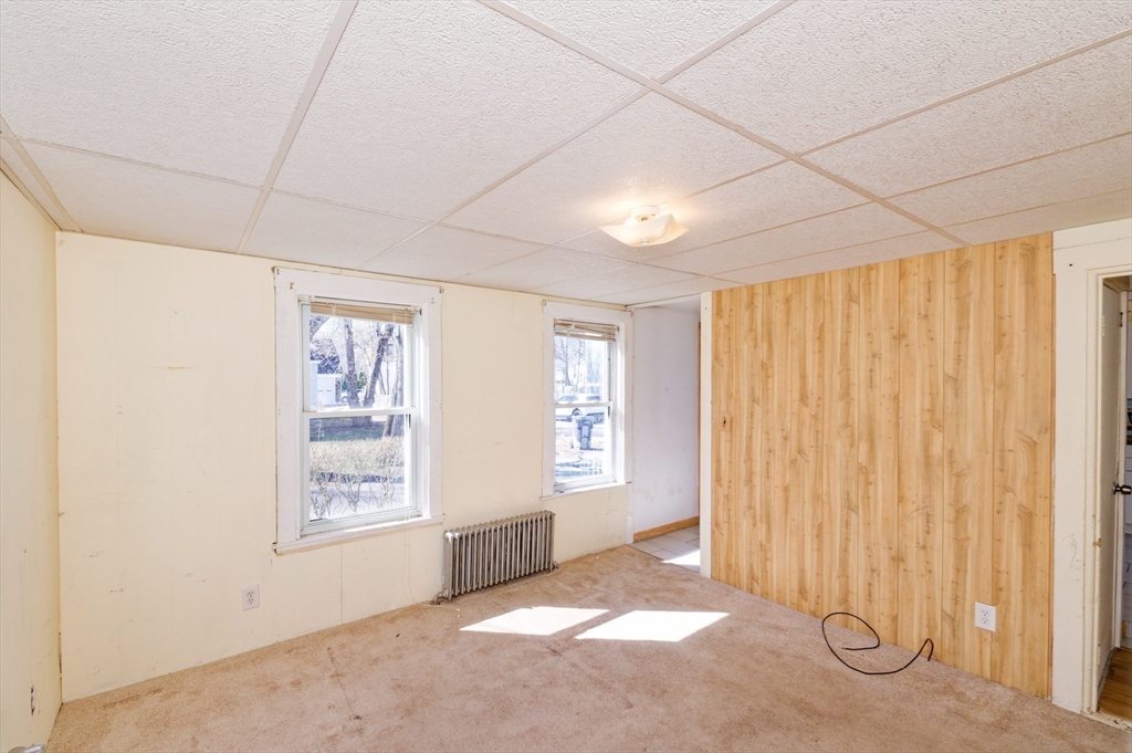 7 Cross Street Natick, MA 01760 - Photo 12 of 31 a view of an empty room with a window
