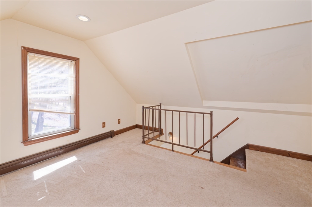 7 Cross Street Natick, MA 01760 - Photo 15 of 31 a view of a room with rack on the wall and a window