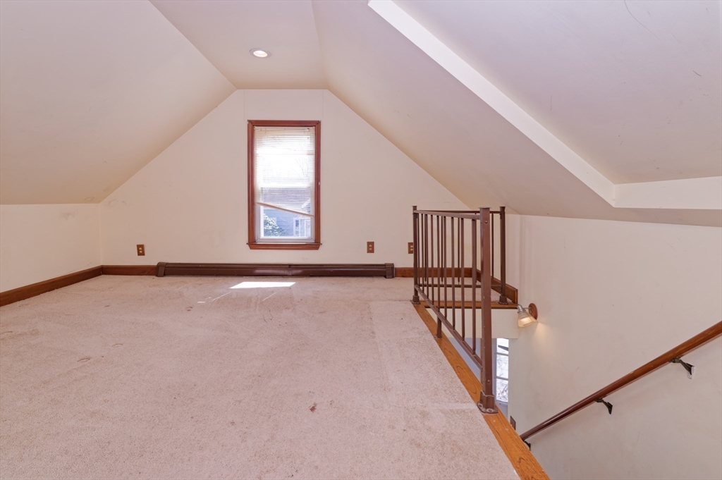 7 Cross Street Natick, MA 01760 - Photo 17 of 31 a view of an empty room with wooden floor and windows