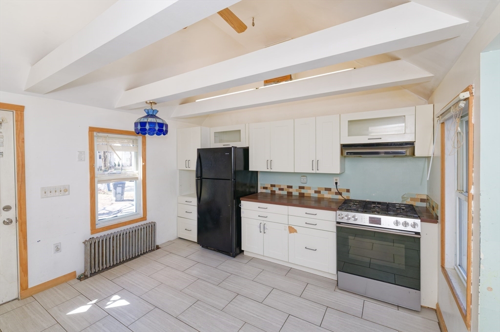 7 Cross Street Natick, MA 01760 - Photo 2 of 31 a kitchen with stainless steel appliances granite countertop a refrigerator sink and stove