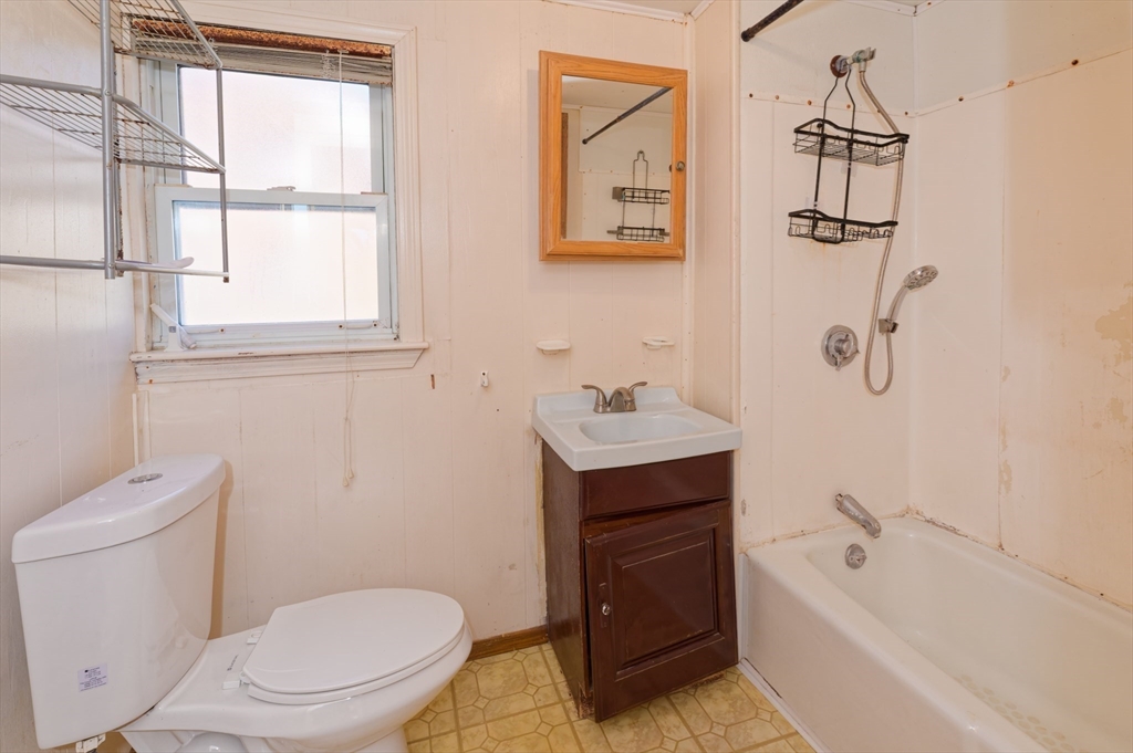 7 Cross Street Natick, MA 01760 - Photo 25 of 31 a bathroom with a sink a toilet and shower