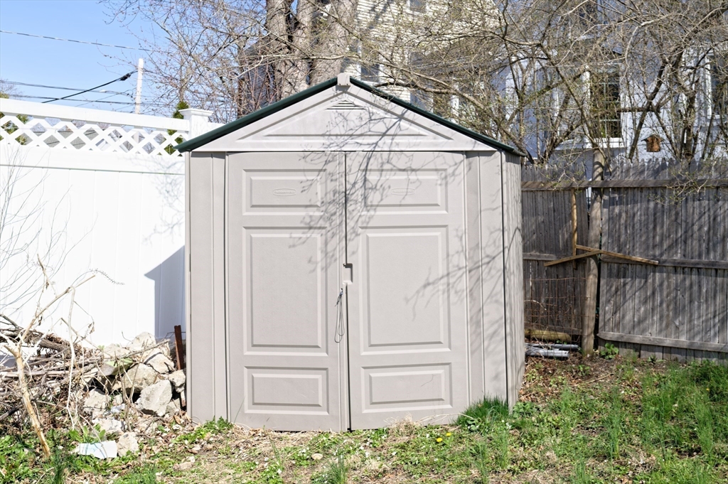 7 Cross Street Natick, MA 01760 - Photo 26 of 31 a front view of a house with a yard