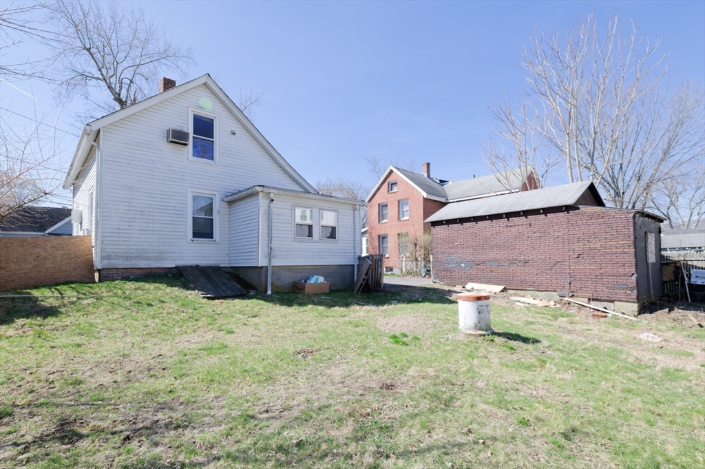 7 Cross Street Natick, MA 01760 - Photo 28 of 31 a front view of a house with garden