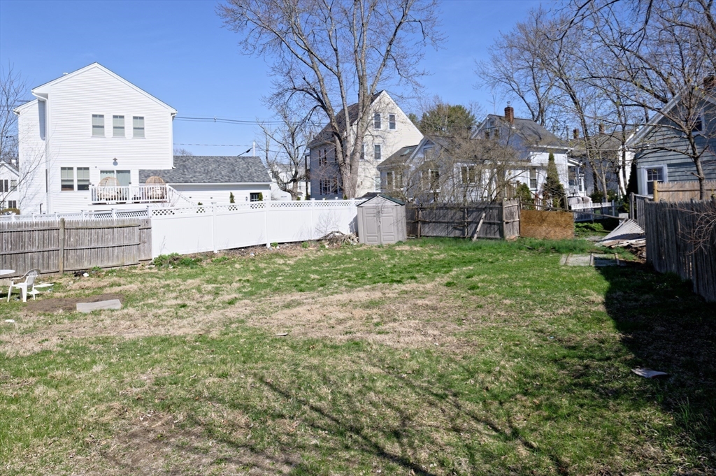 7 Cross Street Natick, MA 01760 - Photo 29 of 31 a view of a yard with a house