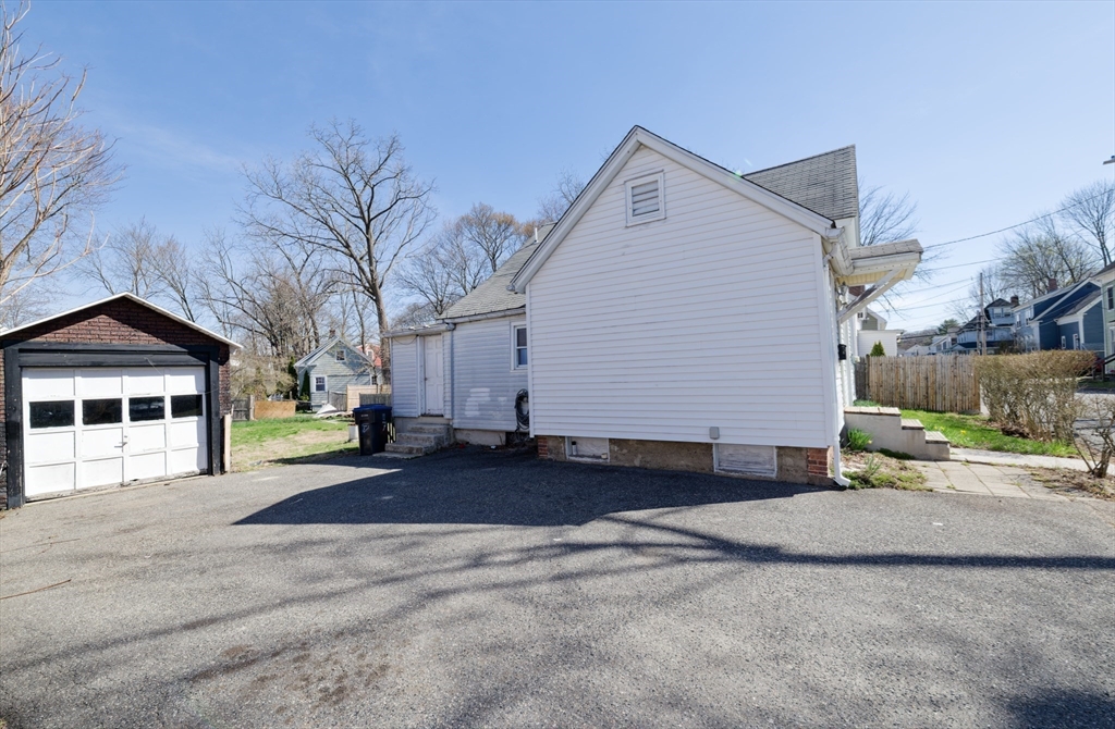 7 Cross Street Natick, MA 01760 - Photo 30 of 31 a view of a house with a yard