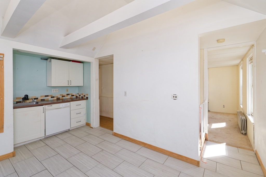 7 Cross Street Natick, MA 01760 - Photo 3 of 31 a bathroom with a granite countertop sink and a mirror