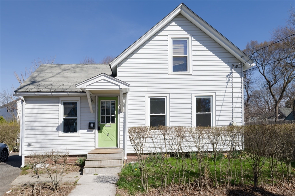7 Cross Street Natick, MA 01760 - Photo 31 of 31 a front view of a house with a garden