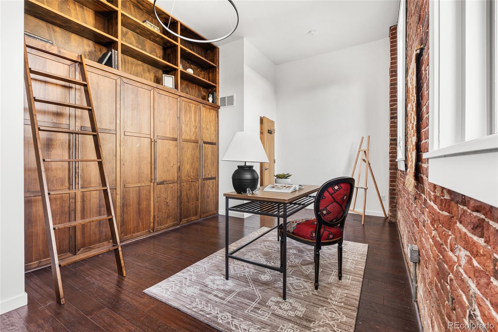 2501 Grove Street, Unit 101 Denver, CO 80211 - Photo 26 of 37 a view of a workspace with furniture and a window