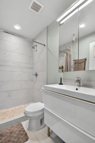 a bathroom with a toilet a sink and a bathtub