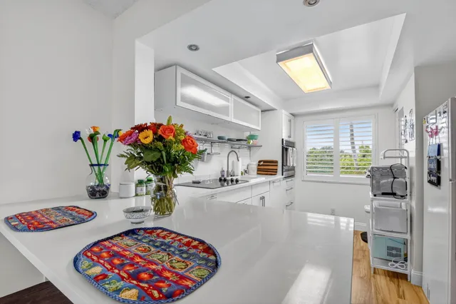 a dining room with furniture and chandelier