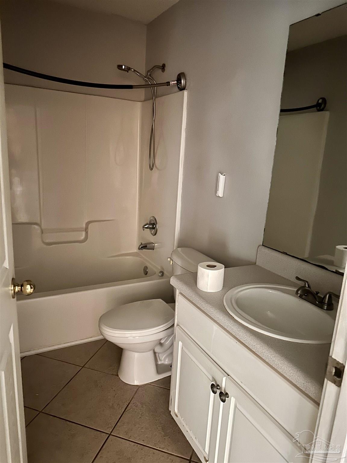 5582 Berrybrook Circle Pace, FL 32571 - Photo 13 of 15 a bathroom with a sink a toilet and shower