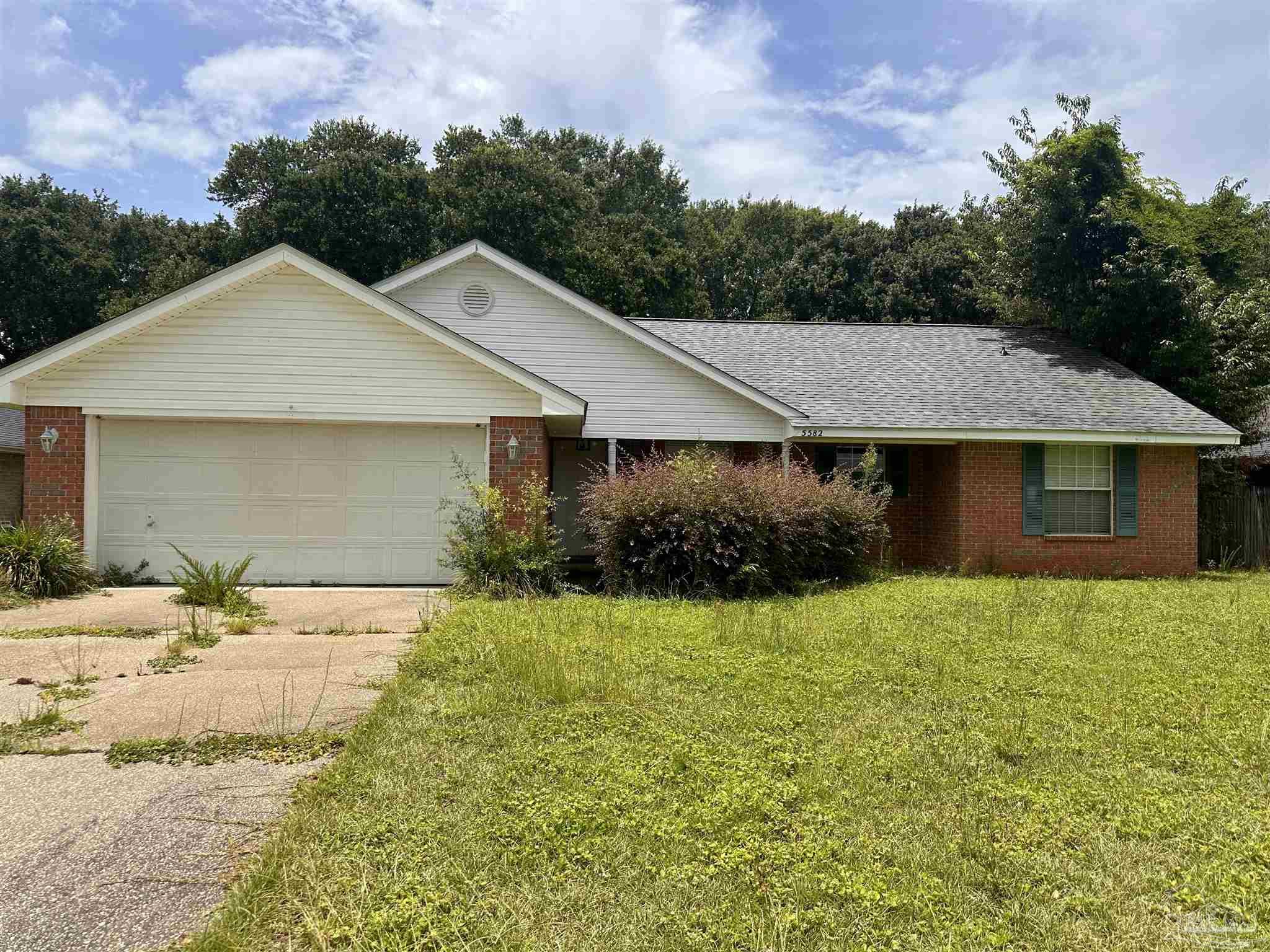 5582 Berrybrook Circle Pace, FL 32571 - Photo 2 of 15 a aerial view of a house with a yard and garage