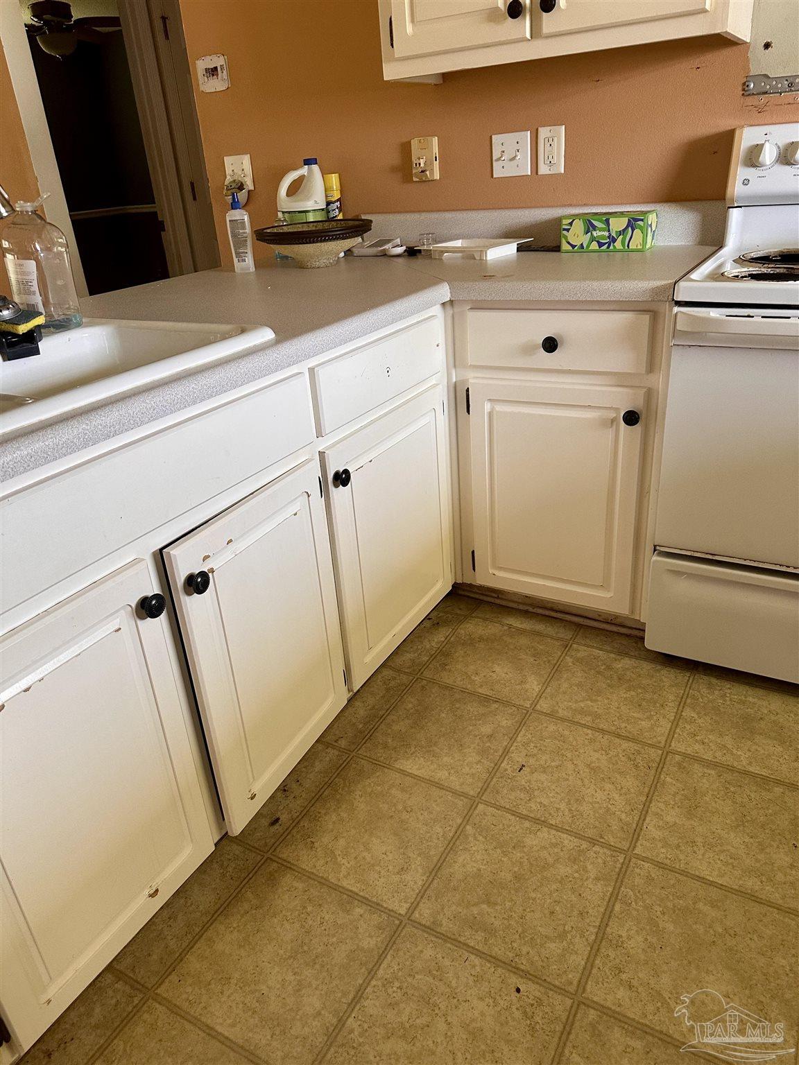 5582 Berrybrook Circle Pace, FL 32571 - Photo 5 of 15 a kitchen with a sink and cabinets