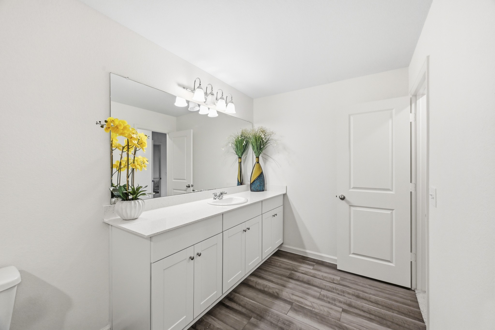 7207 Evitale Way Houston, TX 77049 - Photo 31 of 43 a spacious bathroom with a double vanity sink and a mirror