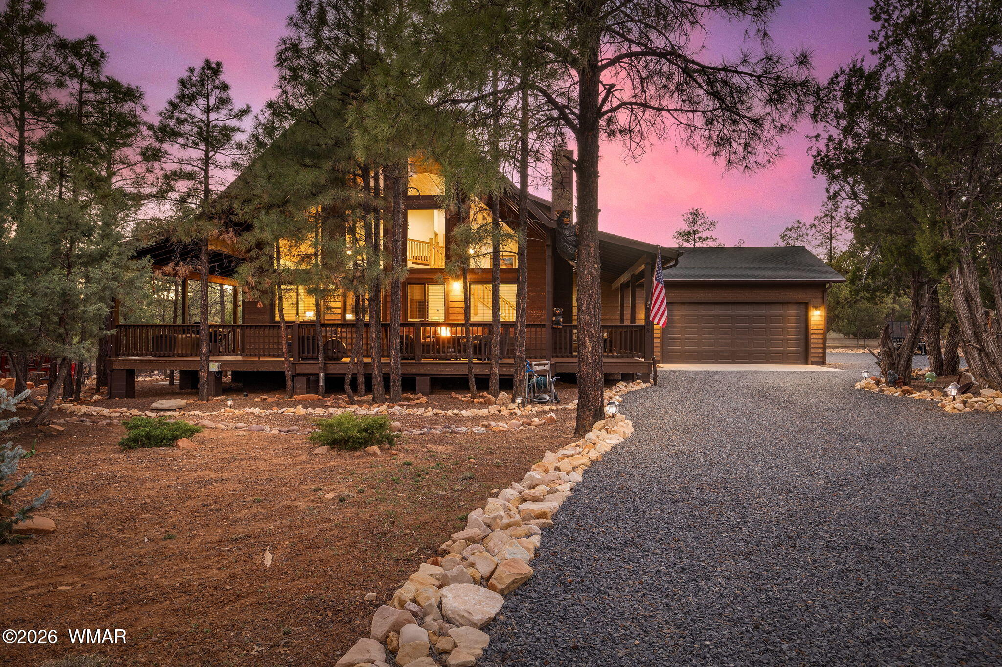 3408 Ponderosa Loop Heber, AZ 85928 - Photo 1 of 57 a front view of a house with a yard covered with snow and trees