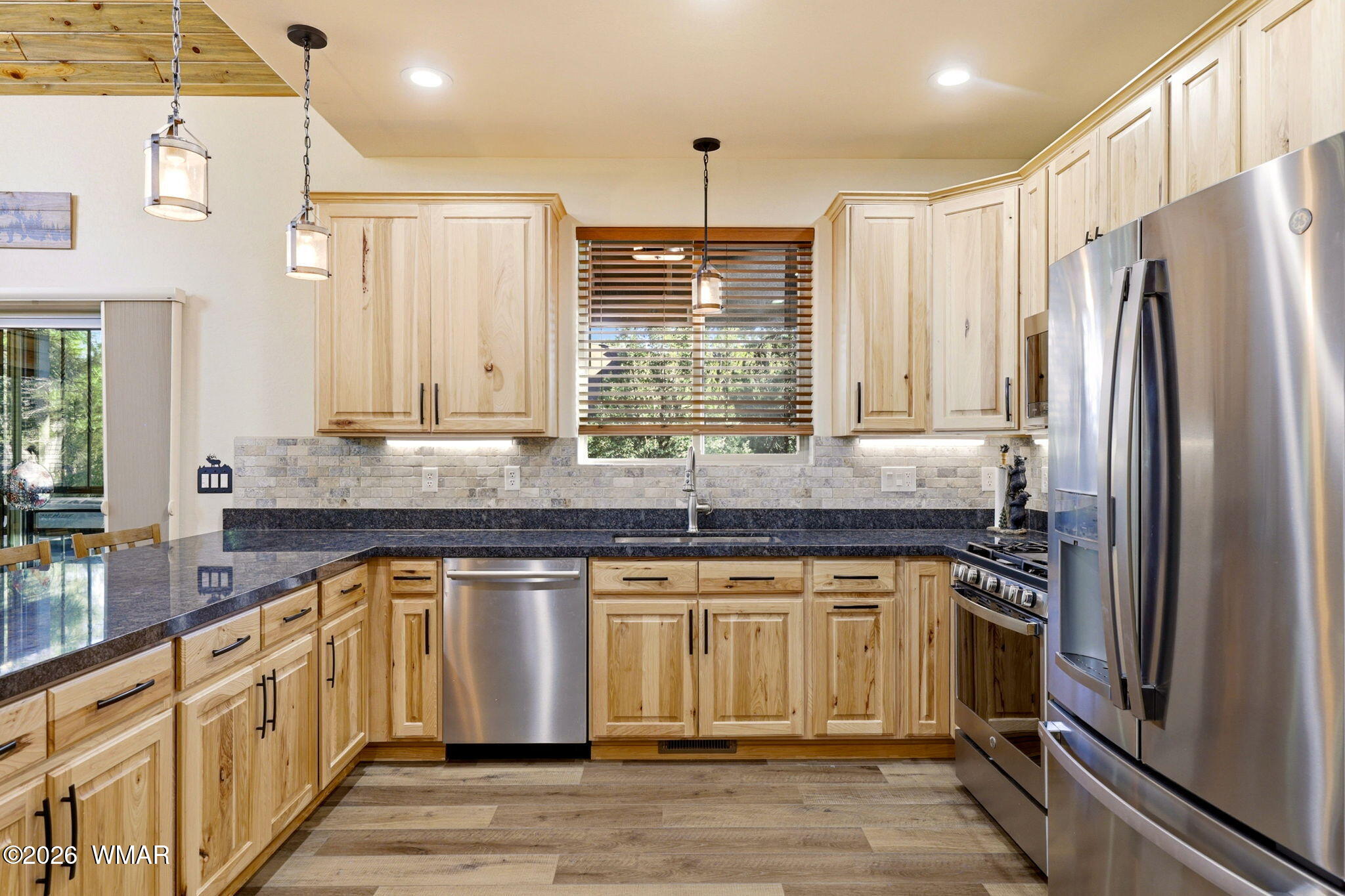 3408 Ponderosa Loop Heber, AZ 85928 - Photo 17 of 57 a kitchen with stainless steel appliances granite countertop a sink stove and refrigerator