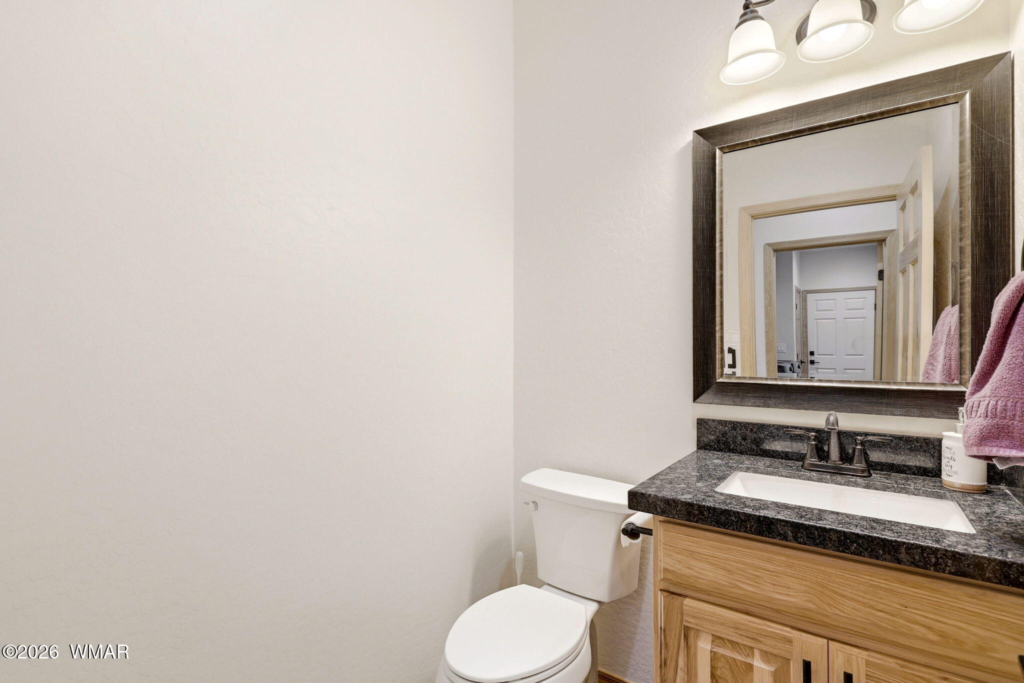 3408 Ponderosa Loop Heber, AZ 85928 - Photo 19 of 57 a bathroom with a granite countertop toilet sink and mirror