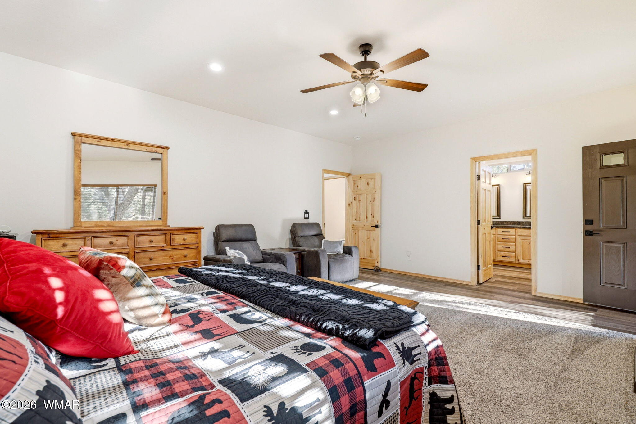 3408 Ponderosa Loop Heber, AZ 85928 - Photo 21 of 57 a bedroom with a large bed and a chandelier