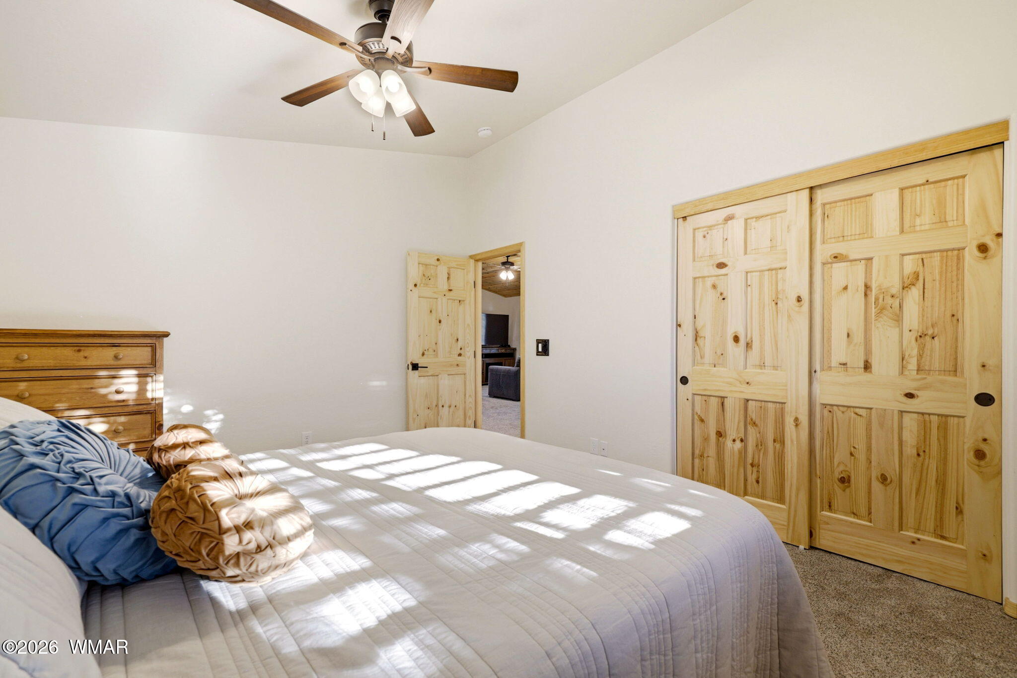 3408 Ponderosa Loop Heber, AZ 85928 - Photo 32 of 57 a bedroom with a bed and a chandelier