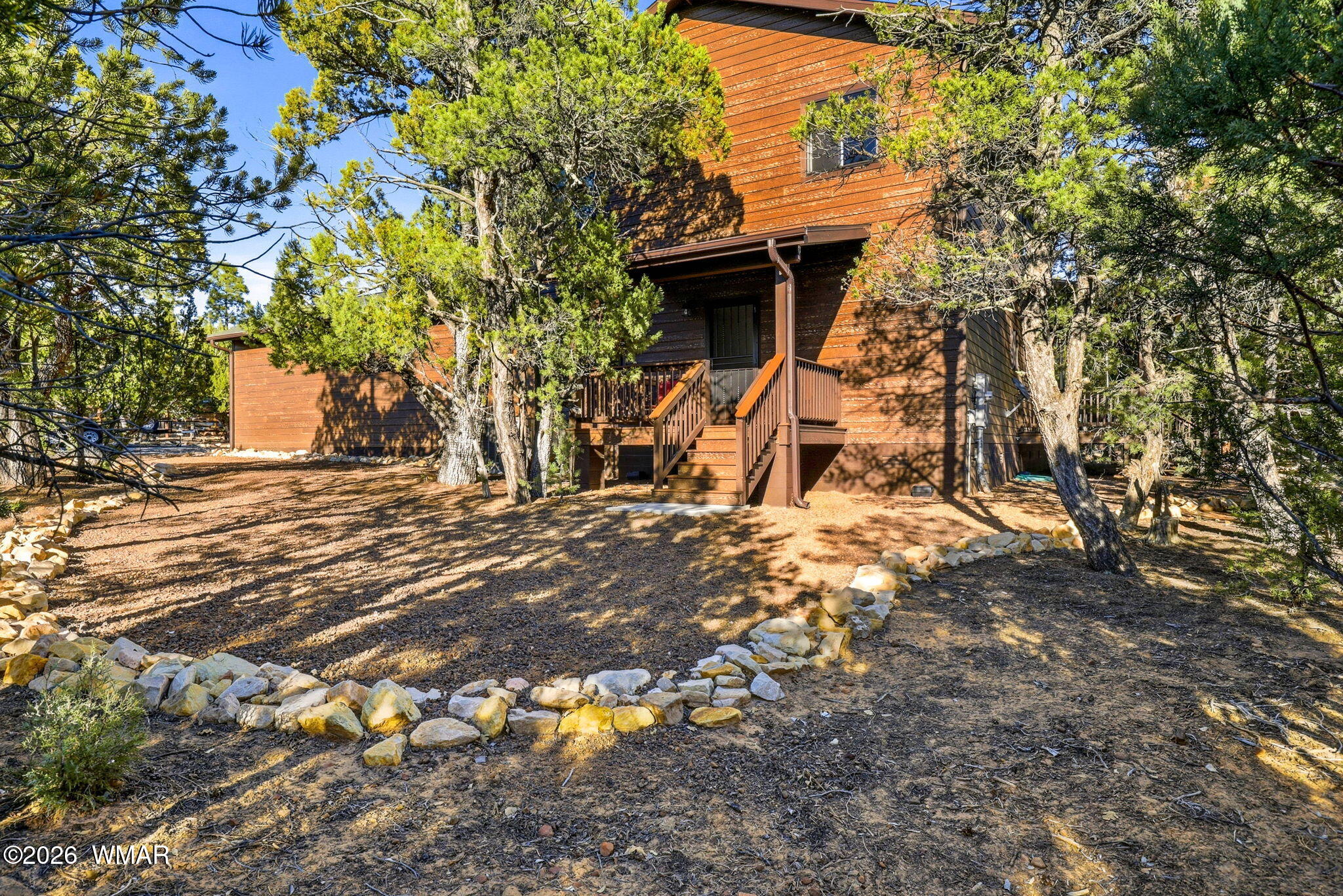 3408 Ponderosa Loop Heber, AZ 85928 - Photo 41 of 57 a view of a wooden house with a yard