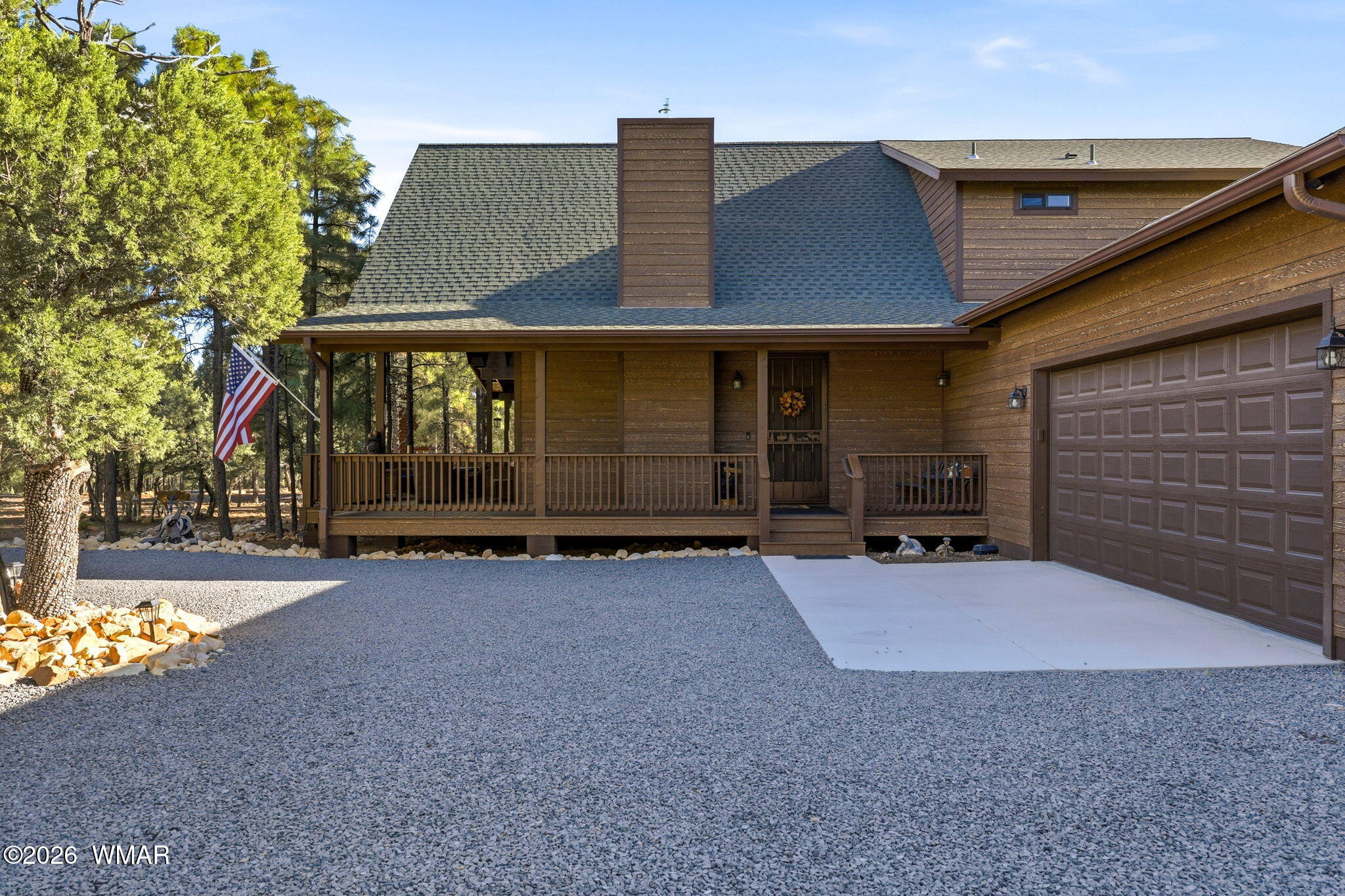 3408 Ponderosa Loop Heber, AZ 85928 - Photo 7 of 57 a front view of a house with a yard and garage