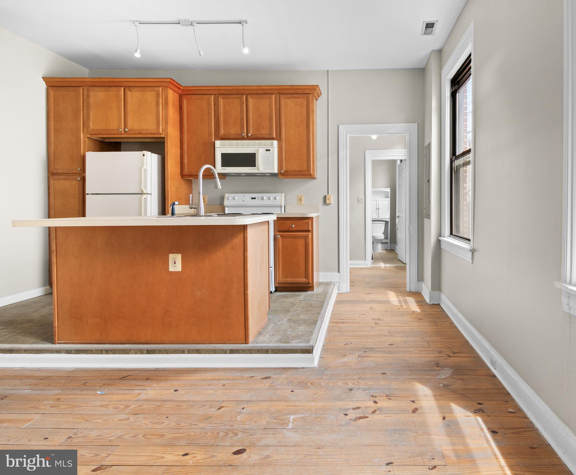2112 Fleet Street Baltimore, MD 21231 - Photo 17 of 62 a view of kitchen with stainless steel appliances granite countertop cabinets and window