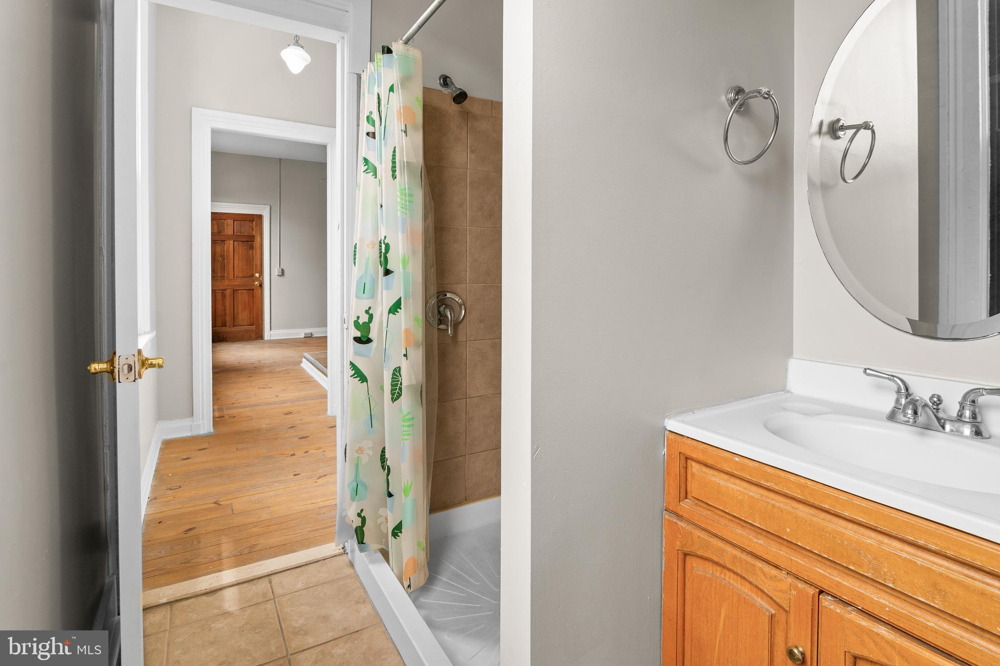 2112 Fleet Street Baltimore, MD 21231 - Photo 29 of 62 a bathroom with a sink vanity and a mirror