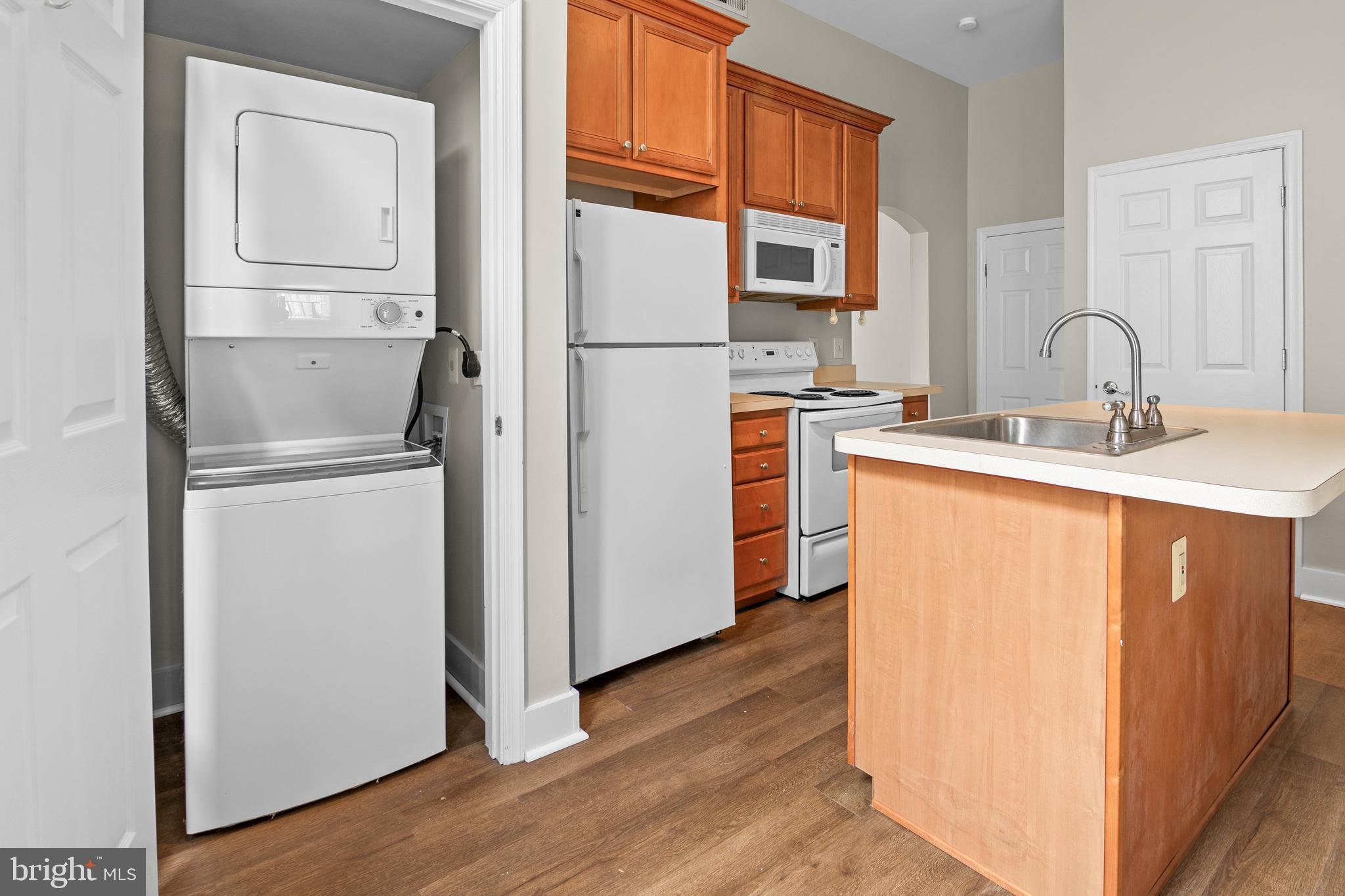 2112 Fleet Street Baltimore, MD 21231 - Photo 35 of 62 a kitchen with a refrigerator sink and cabinets