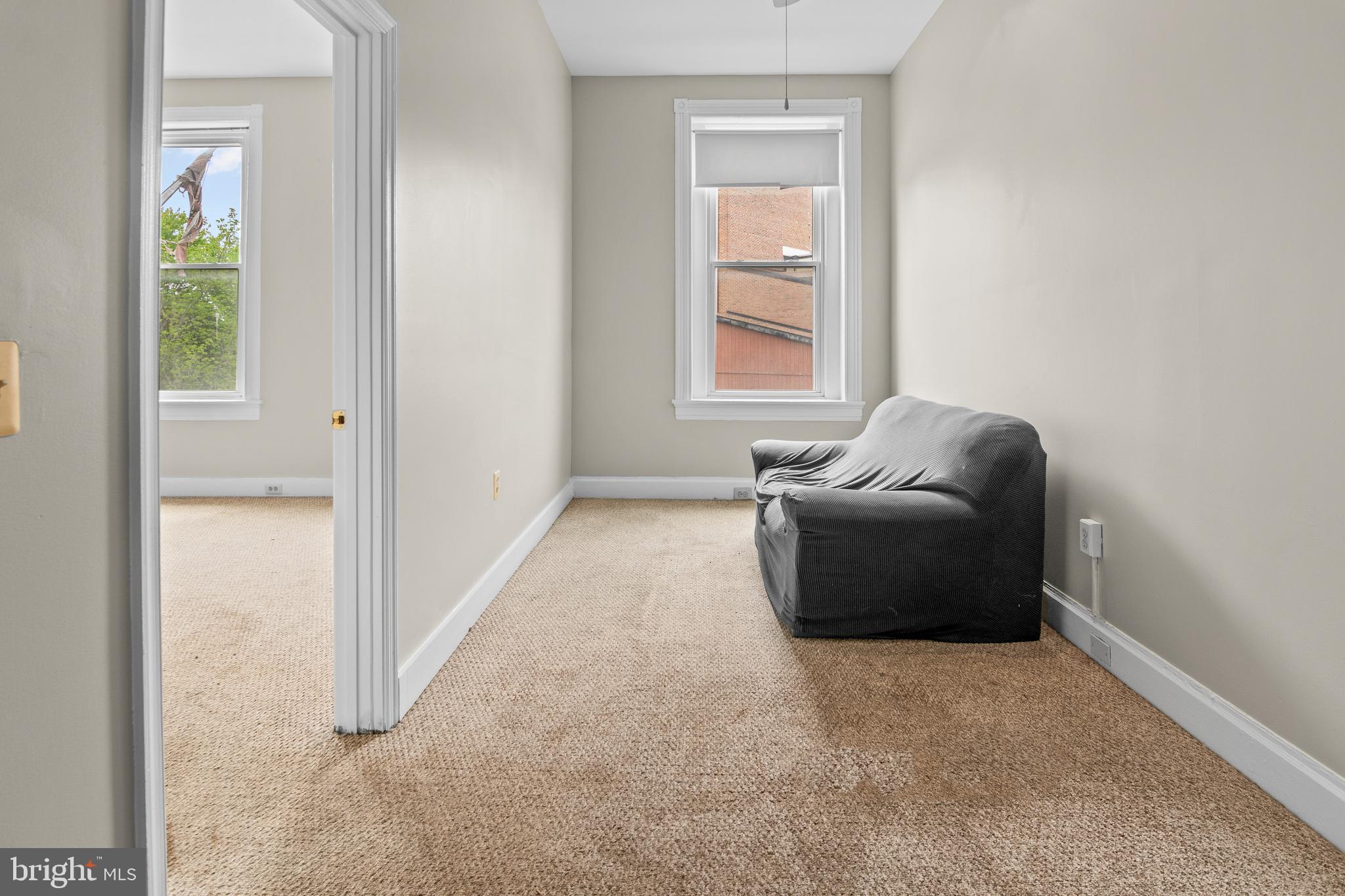 2112 Fleet Street Baltimore, MD 21231 - Photo 39 of 62 a living room with furniture and a window