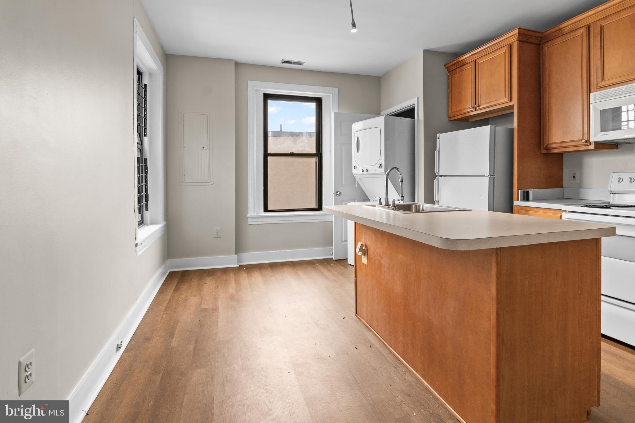 2112 Fleet Street Baltimore, MD 21231 - Photo 47 of 62 a kitchen with stainless steel appliances granite countertop a sink stove and cabinets