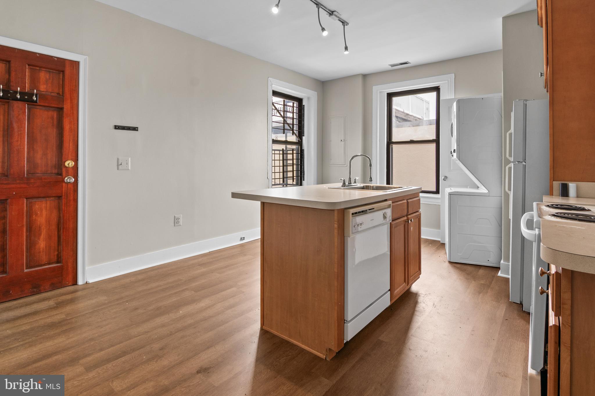 2112 Fleet Street Baltimore, MD 21231 - Photo 49 of 62 a kitchen with stainless steel appliances granite countertop a stove and a refrigerator