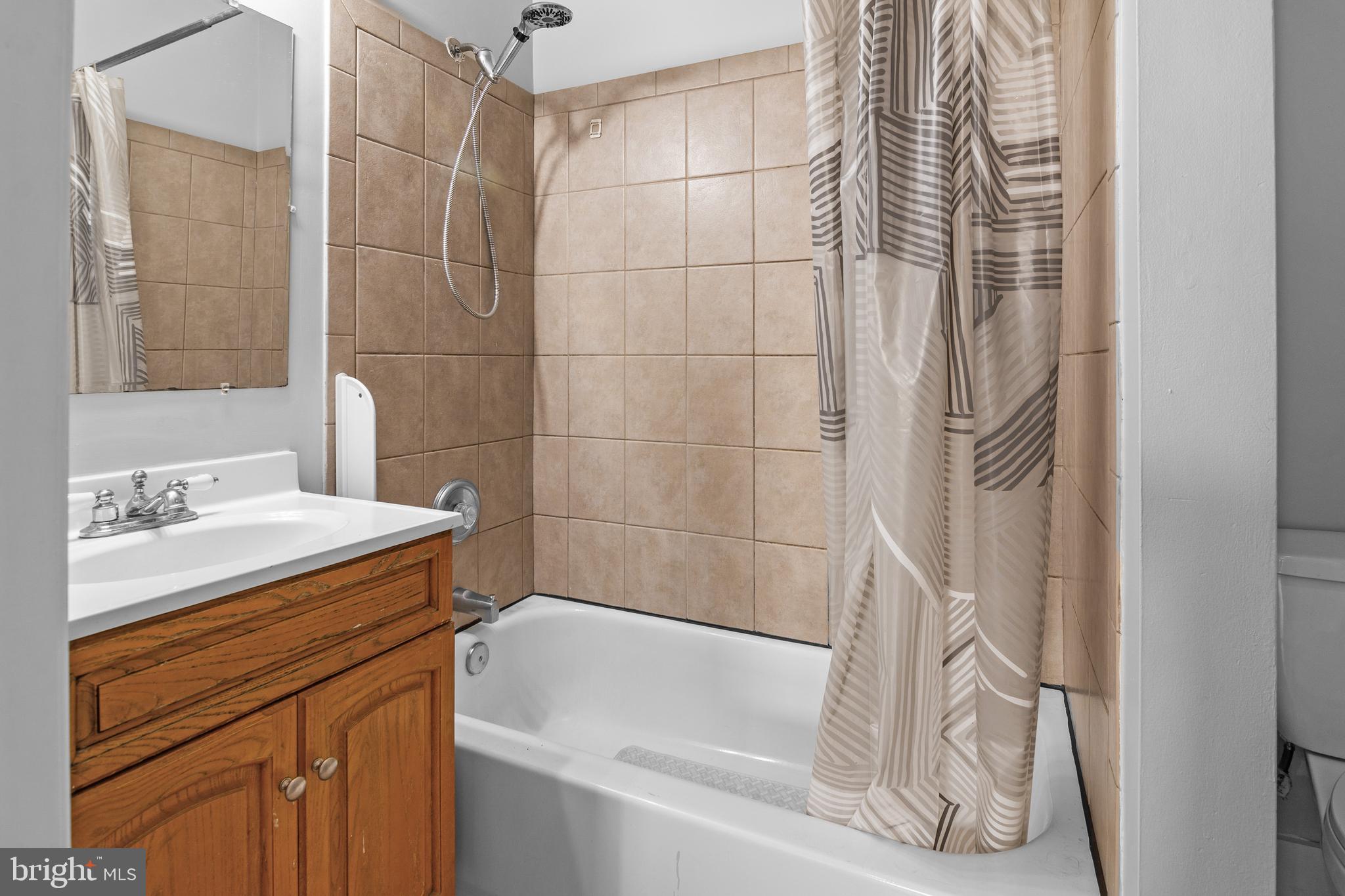 2112 Fleet Street Baltimore, MD 21231 - Photo 52 of 62 a bathroom with a sink and a bathtub