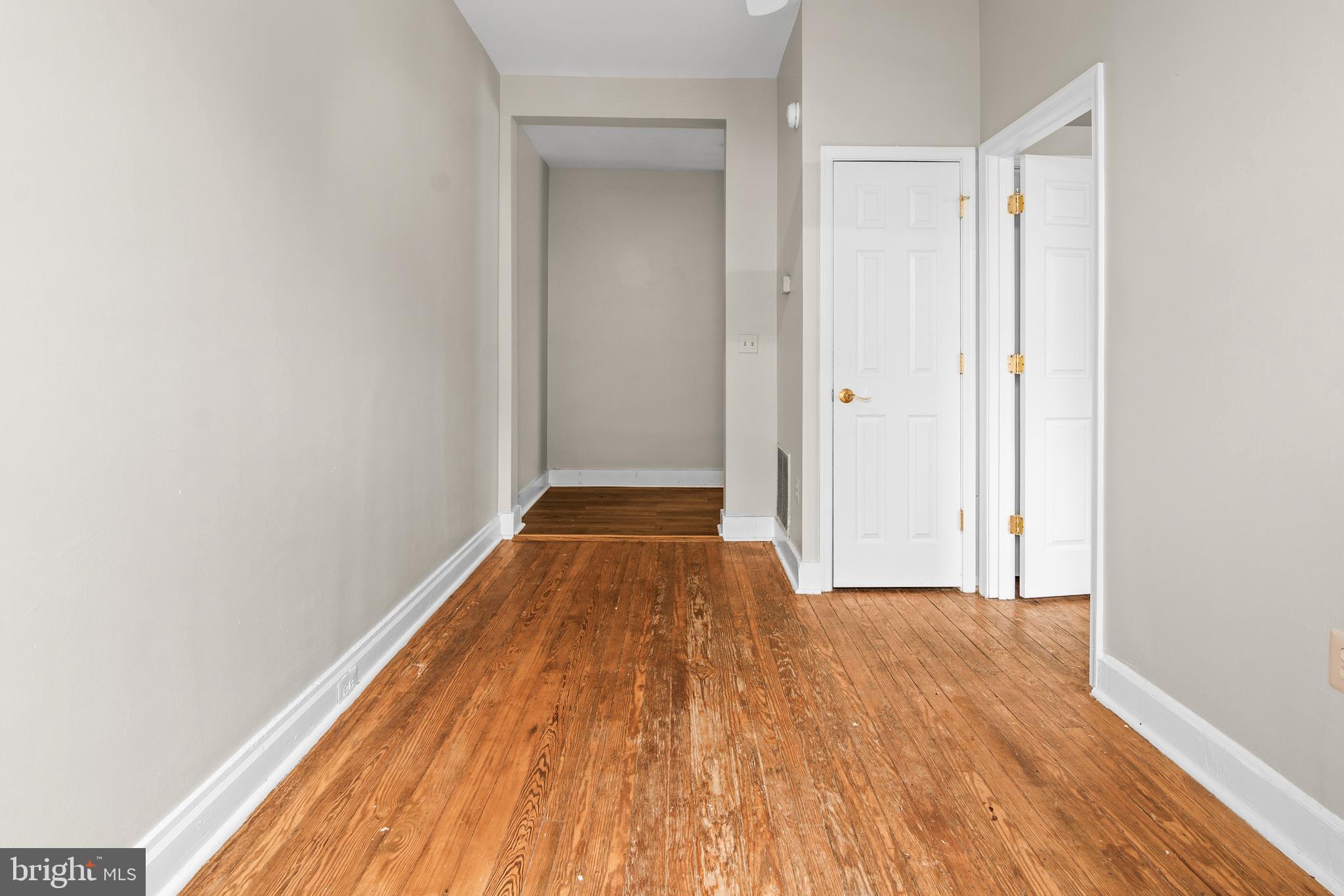 2112 Fleet Street Baltimore, MD 21231 - Photo 57 of 62 a view of a room with wooden floor and a window