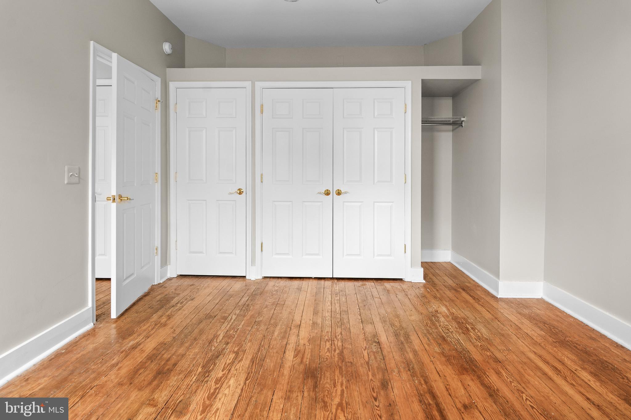 2112 Fleet Street Baltimore, MD 21231 - Photo 60 of 62 a view of an empty room with wooden floor
