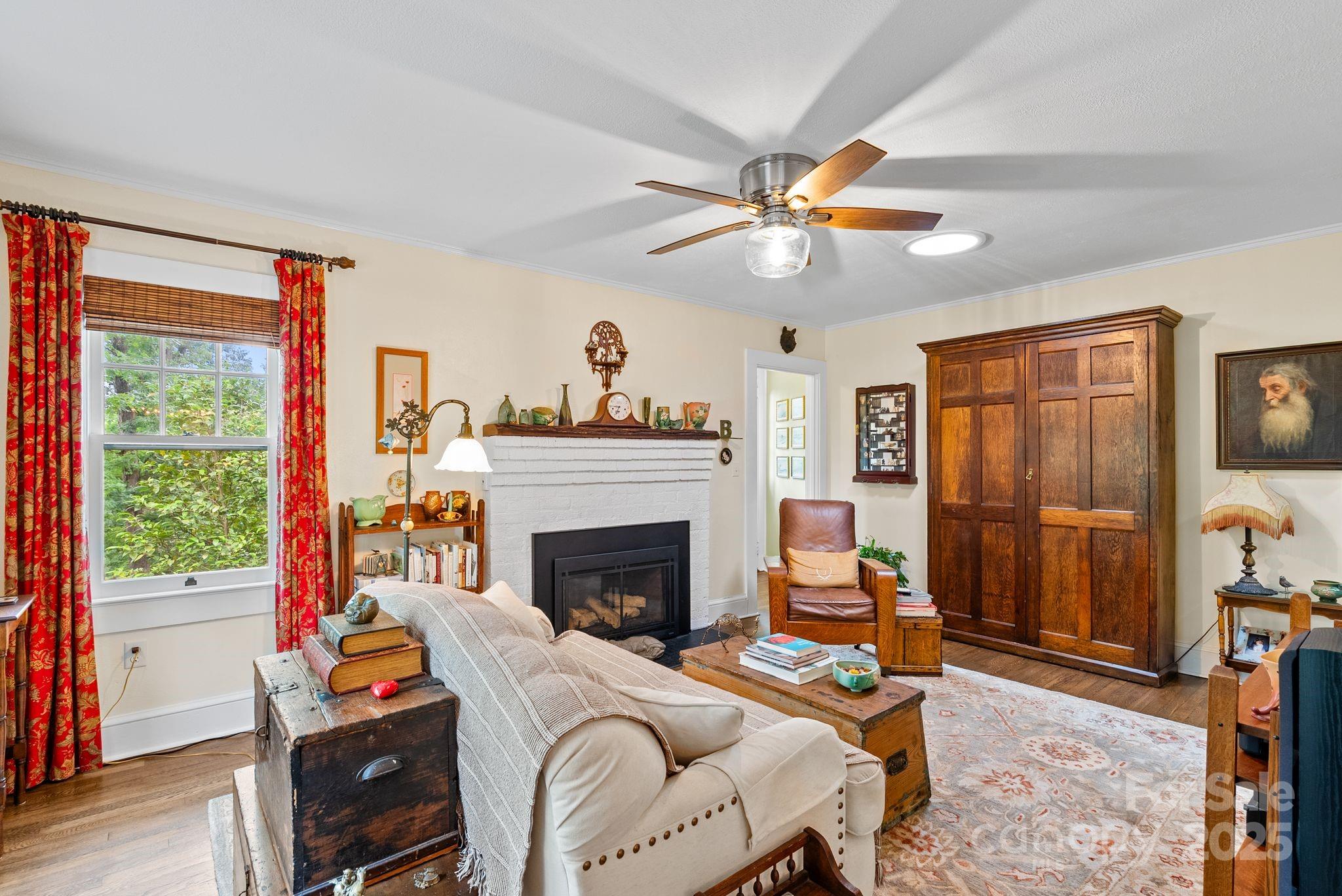 160 Hidden Hill Road Tryon, NC 28782 - Photo 11 of 47 a living room with furniture and a fireplace