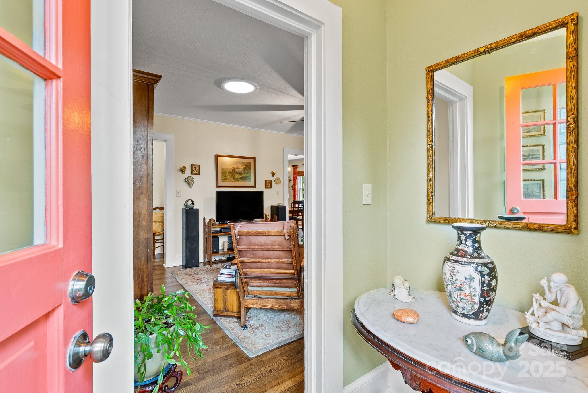 160 Hidden Hill Road Tryon, NC 28782 - Photo 14 of 47 a view of a dining room with furniture window and wooden floor