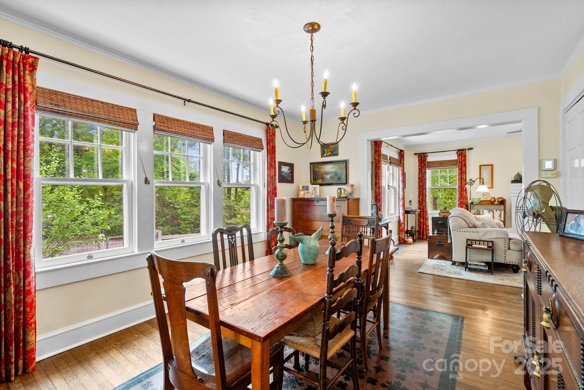 160 Hidden Hill Road Tryon, NC 28782 - Photo 17 of 47 a view of a dining room with furniture window and wooden floor
