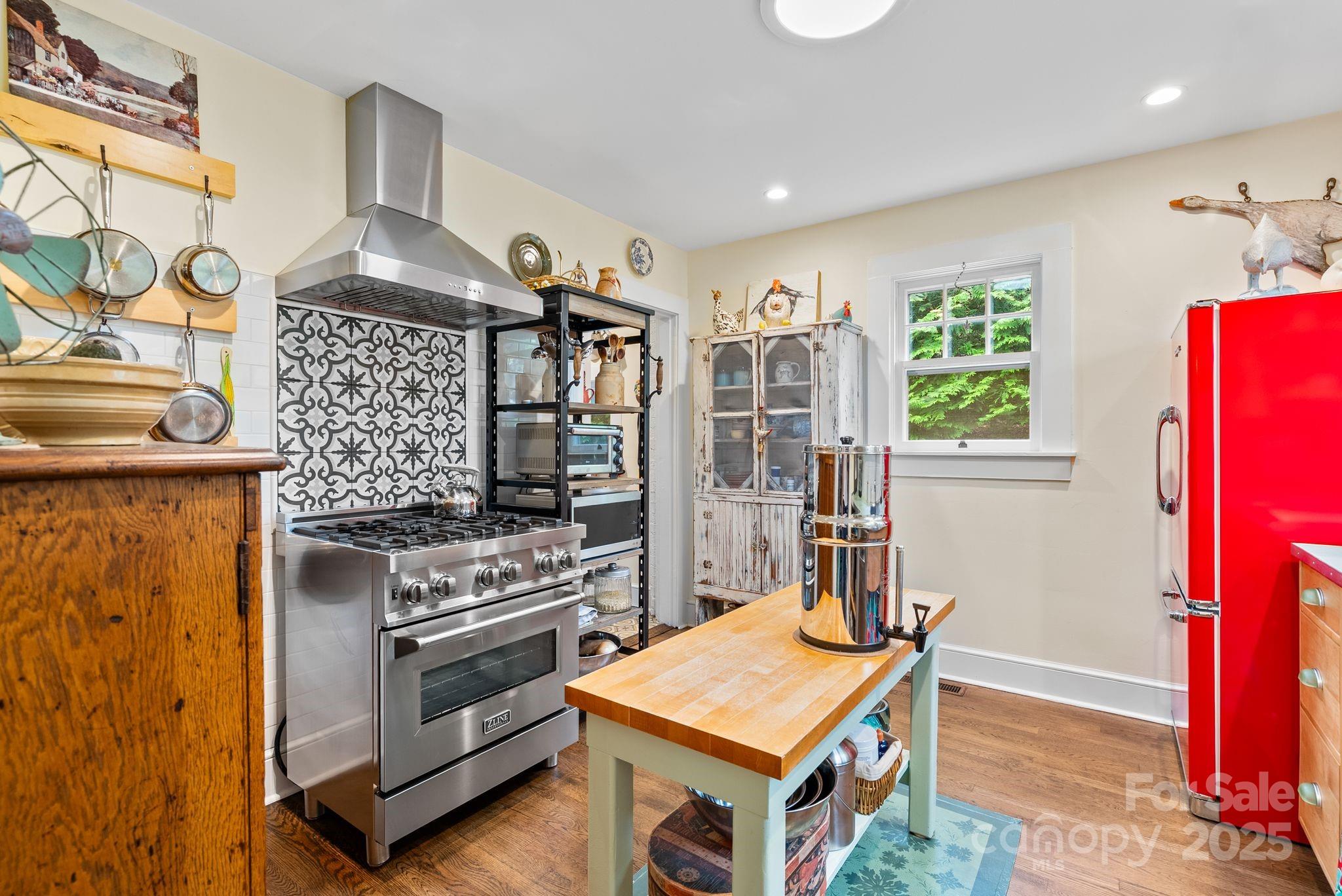 160 Hidden Hill Road Tryon, NC 28782 - Photo 19 of 47 a kitchen with a stove and a refrigerator