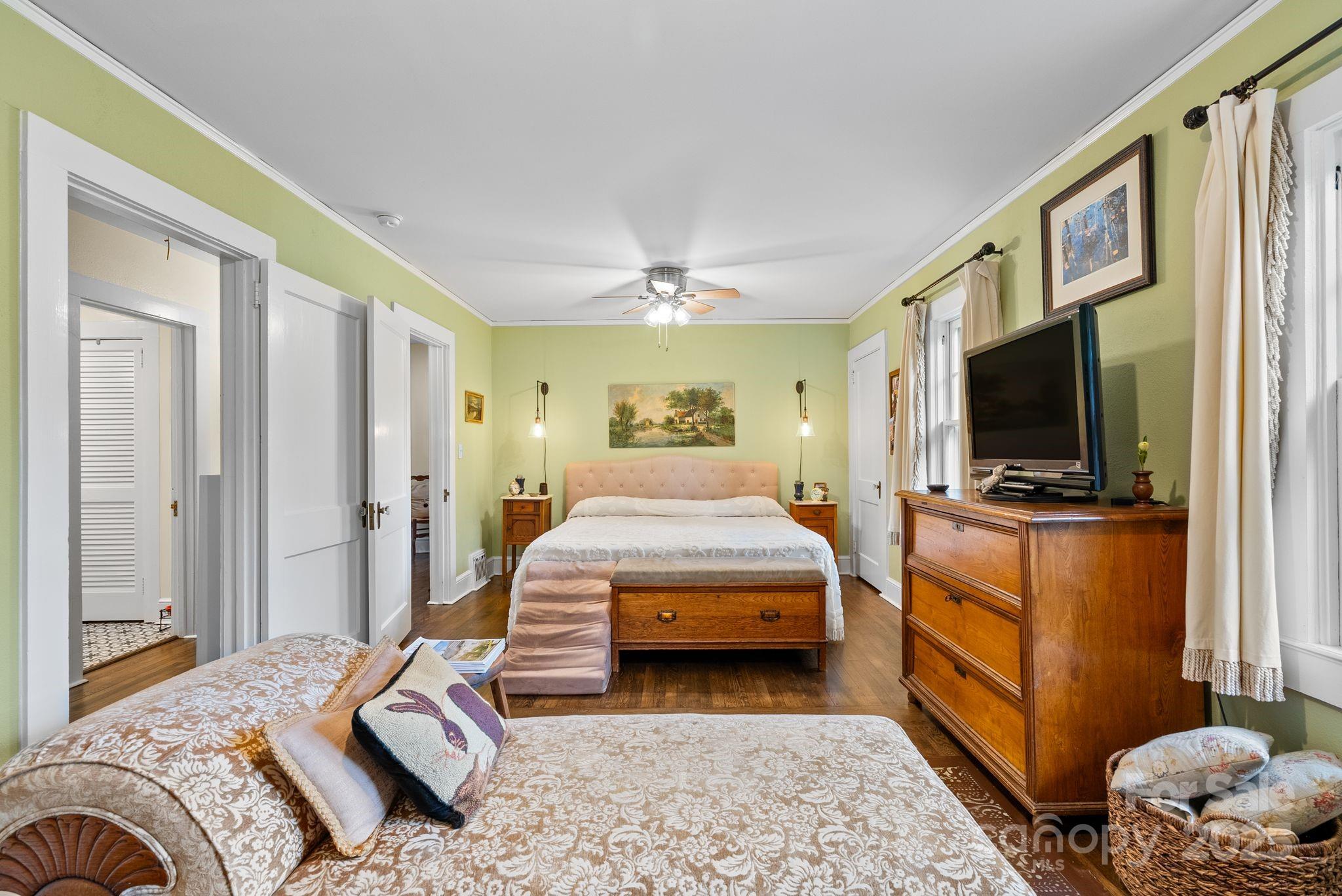 160 Hidden Hill Road Tryon, NC 28782 - Photo 24 of 47 a bedroom with a bed and a flat screen tv