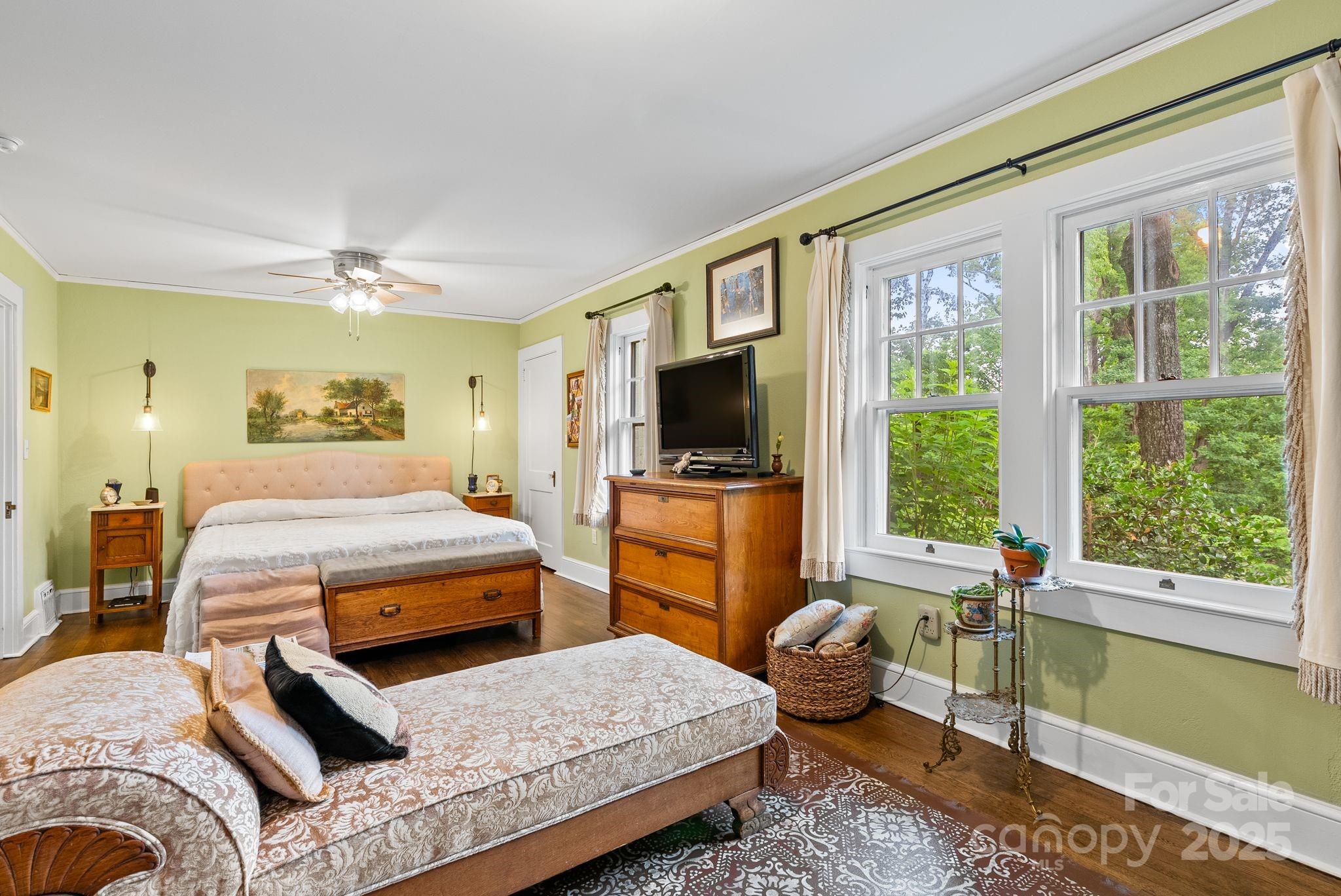 160 Hidden Hill Road Tryon, NC 28782 - Photo 25 of 47 a bedroom with a bed and glass window