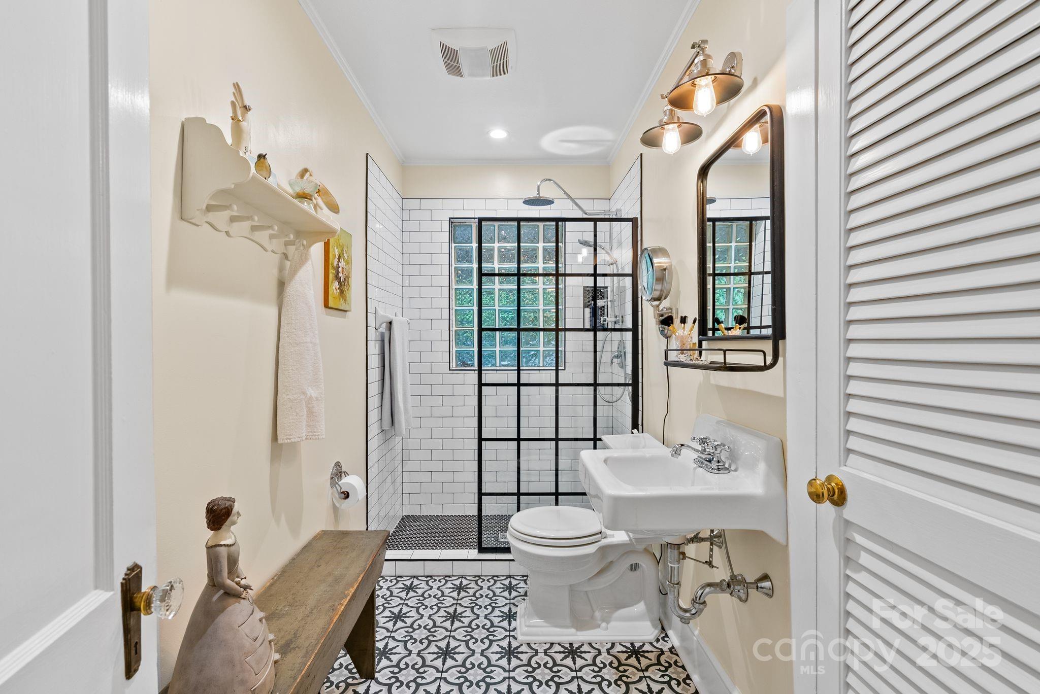 160 Hidden Hill Road Tryon, NC 28782 - Photo 26 of 47 a bathroom with a sink toilet and shower