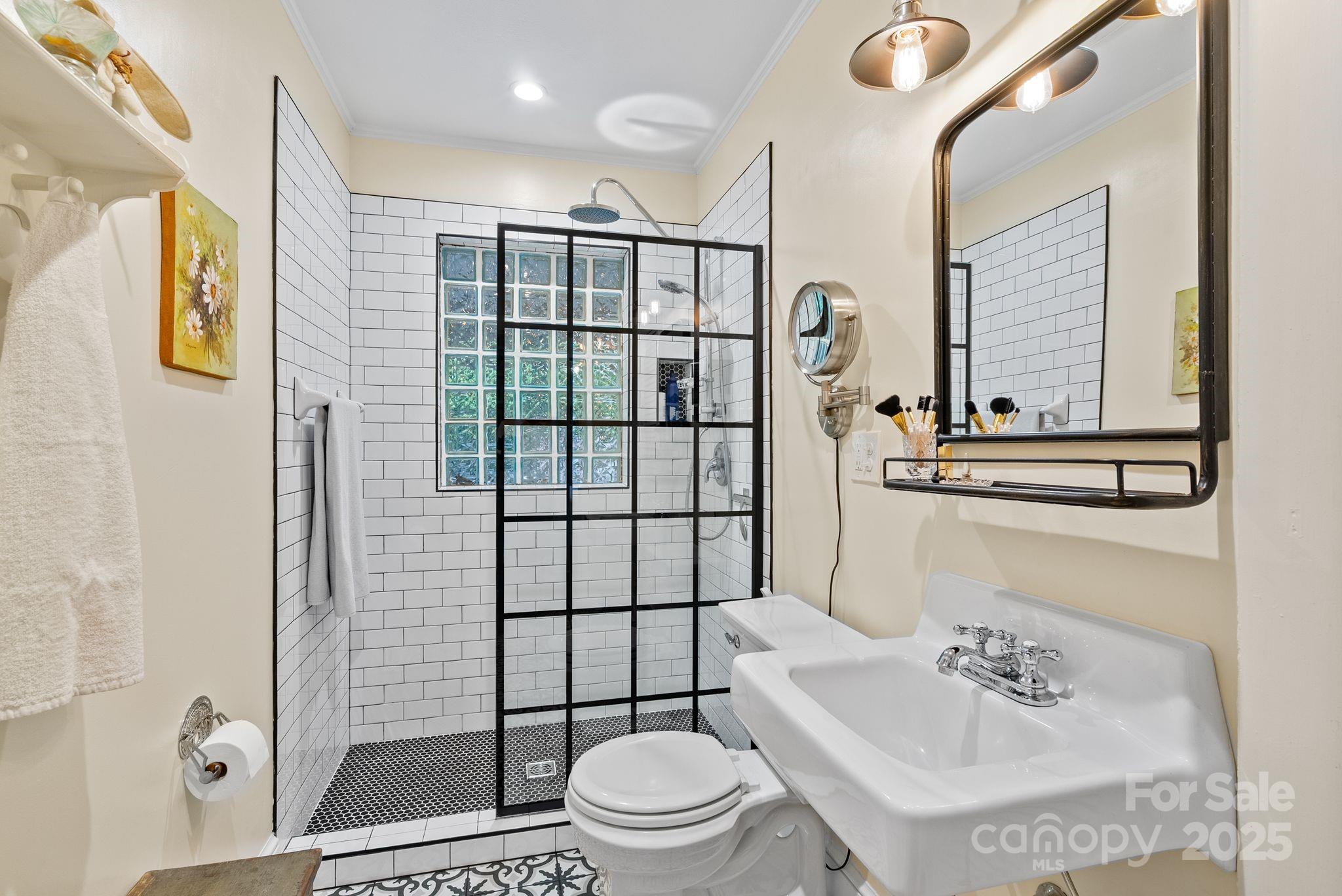160 Hidden Hill Road Tryon, NC 28782 - Photo 27 of 47 a bathroom with a sink toilet and shower
