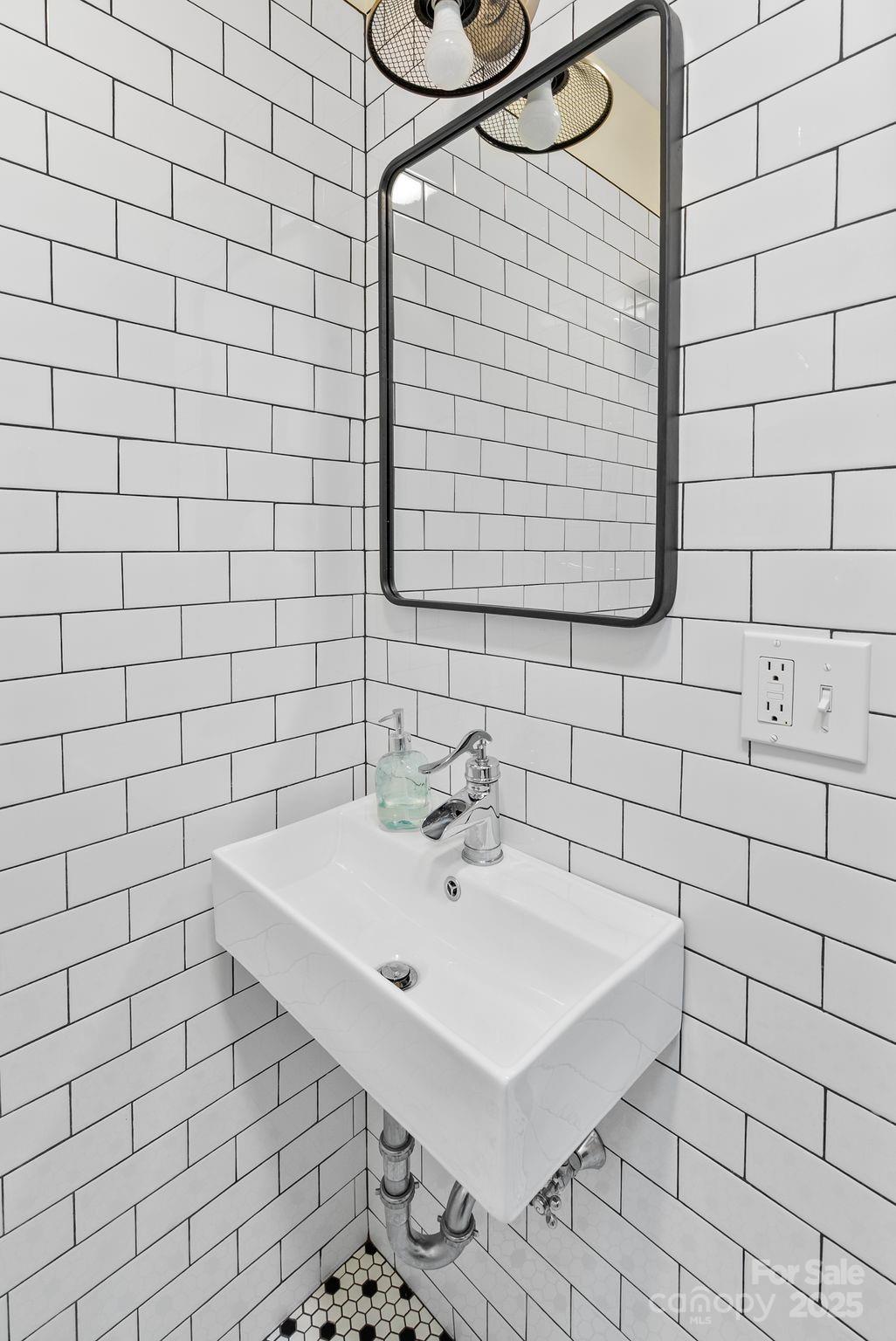 160 Hidden Hill Road Tryon, NC 28782 - Photo 31 of 47 a bathroom with a sink a toilet and shower