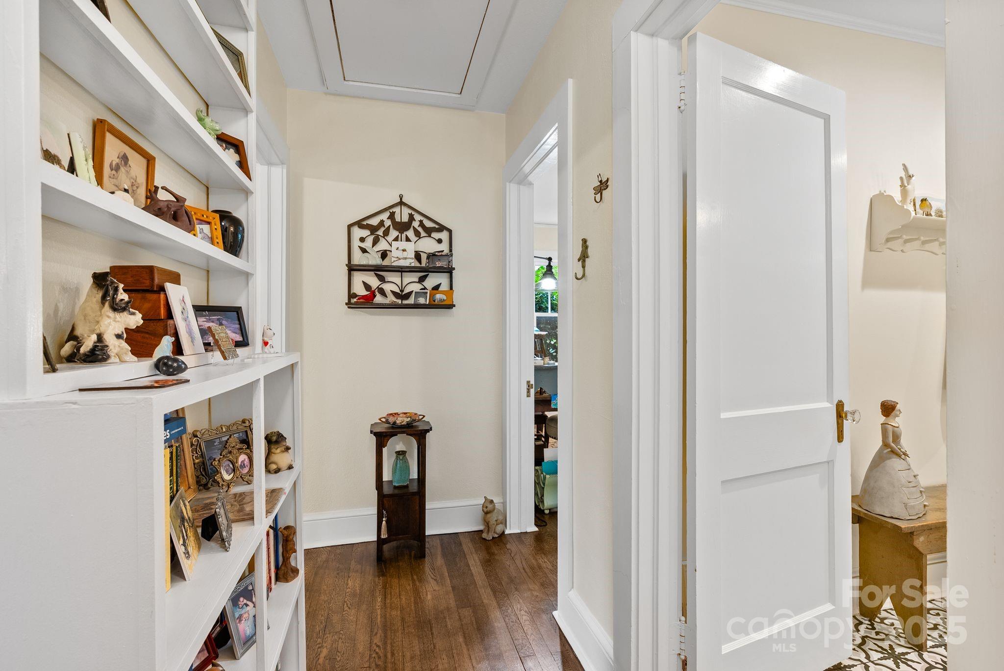 160 Hidden Hill Road Tryon, NC 28782 - Photo 32 of 47 a view of a hallway with wooden floor and workspace