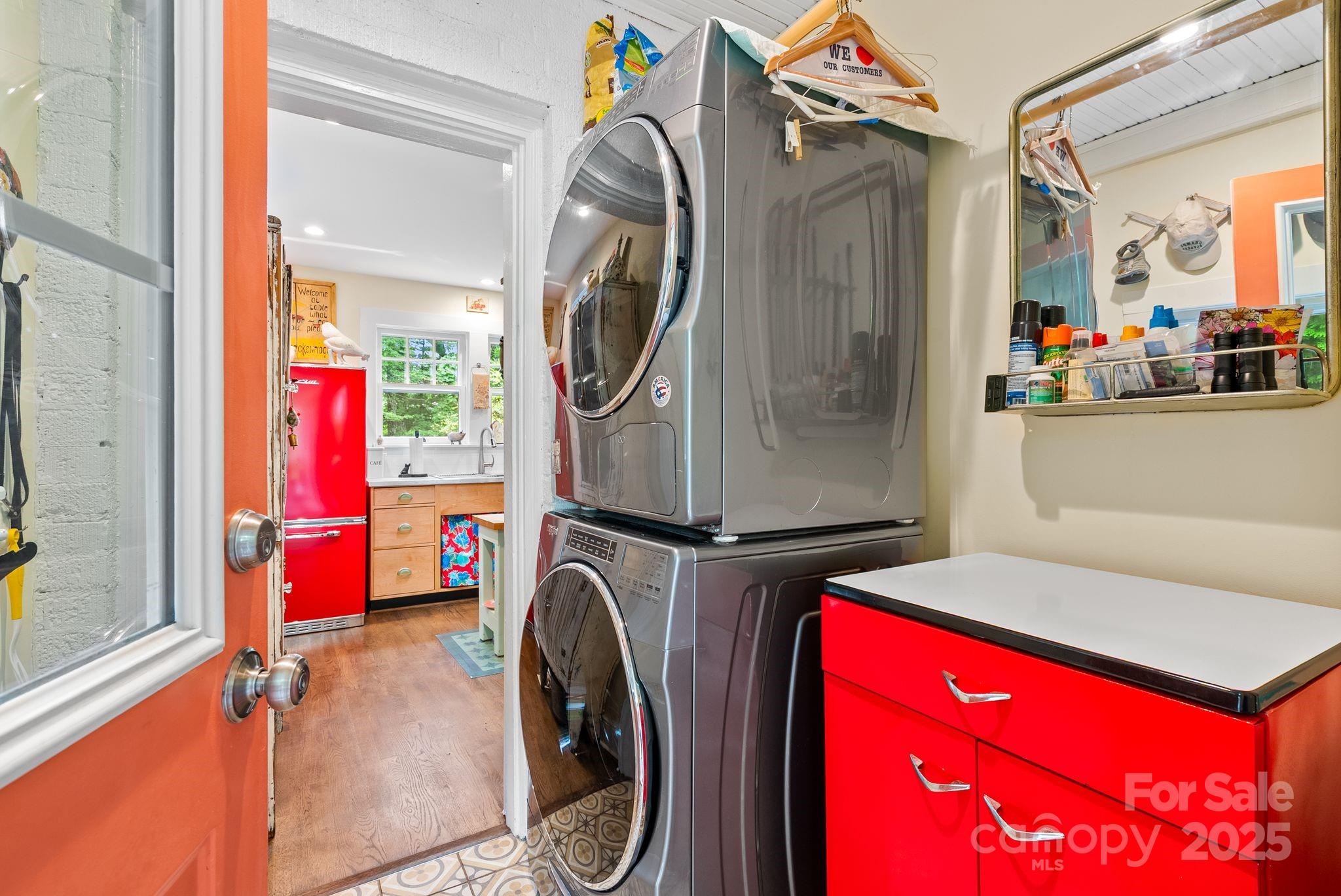160 Hidden Hill Road Tryon, NC 28782 - Photo 36 of 47 a utility room with dryer washer and a mirror